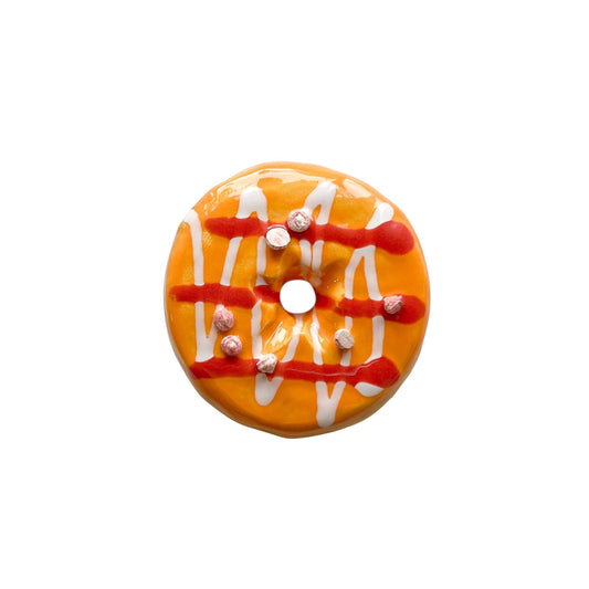 Orange Sherbet Donut With Drizzle And Chips